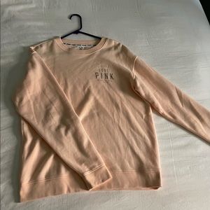 Peach Victoria’s Secret crew neck.